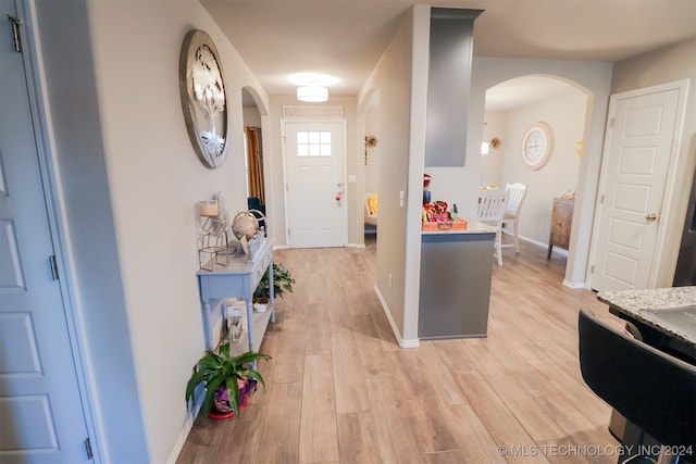 foyer with light wood-type flooring