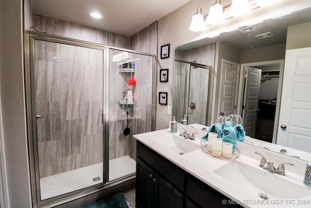 bathroom with vanity and an enclosed shower