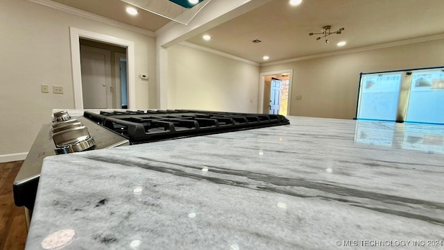 interior details featuring black range and crown molding