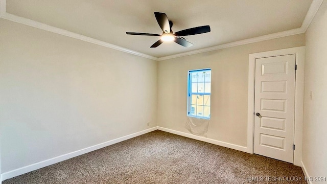 carpeted empty room featuring crown molding and ceiling fan