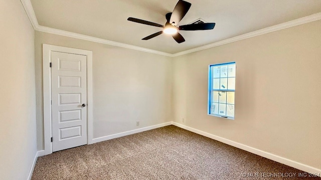 spare room with carpet floors, ceiling fan, and crown molding