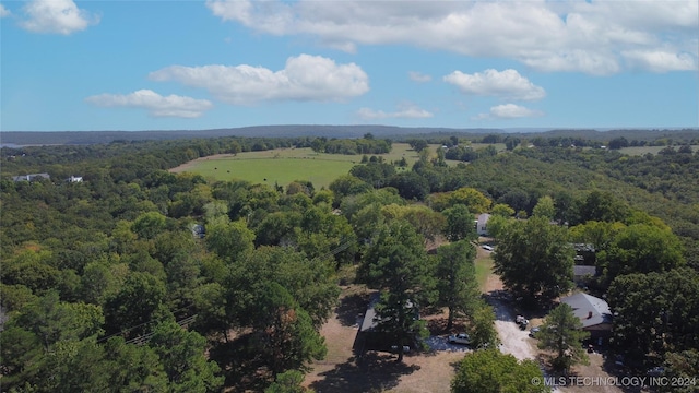 drone / aerial view with a view of trees