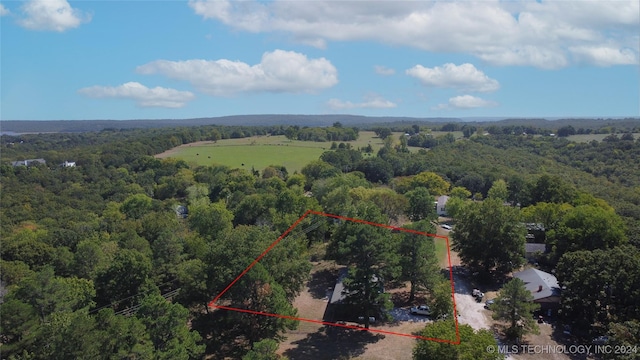 birds eye view of property with a wooded view