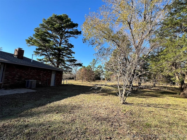 view of yard featuring central AC unit