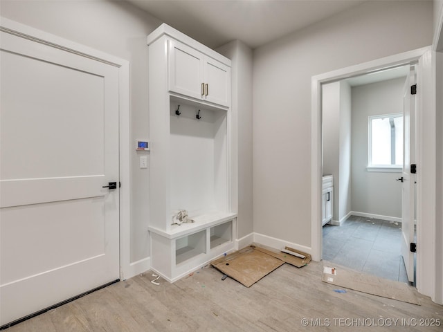 mudroom with light hardwood / wood-style floors