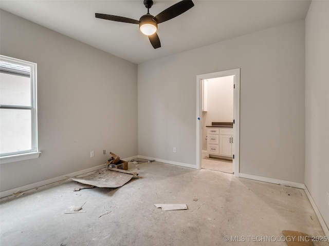 spare room with ceiling fan