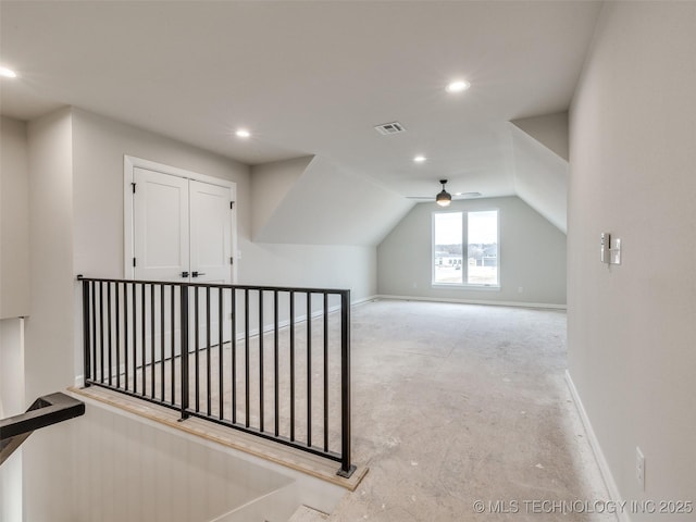 additional living space featuring lofted ceiling and ceiling fan