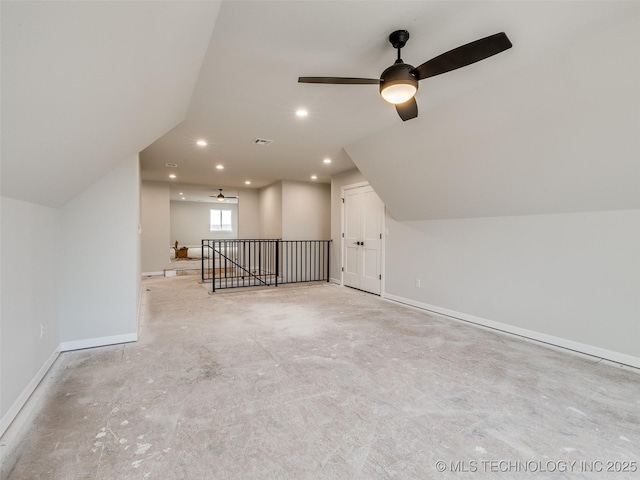 additional living space with vaulted ceiling and ceiling fan