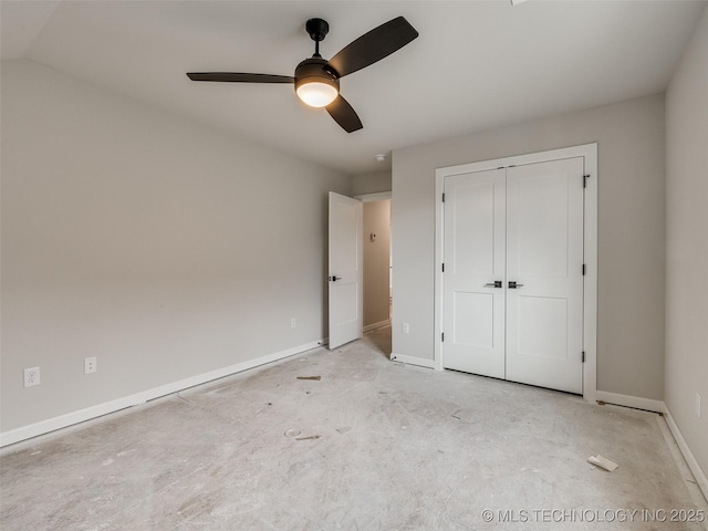 unfurnished bedroom featuring ceiling fan, a closet, and lofted ceiling