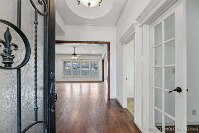 foyer with french doors, dark hardwood / wood-style floors, ceiling fan, and ornamental molding