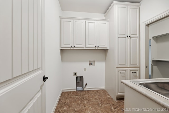 laundry room with hookup for an electric dryer, cabinets, and washer hookup