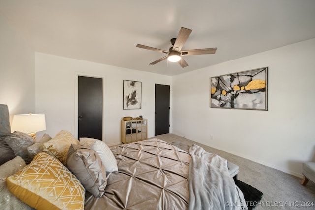 carpeted bedroom featuring ceiling fan