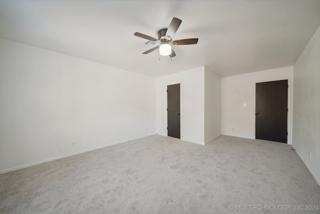 spare room with ceiling fan and carpet floors