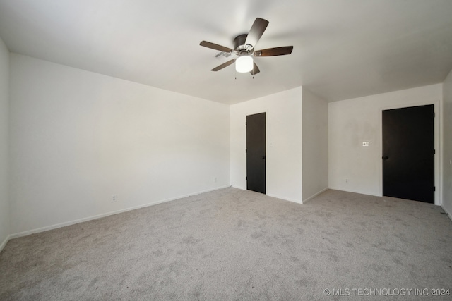 carpeted empty room with ceiling fan