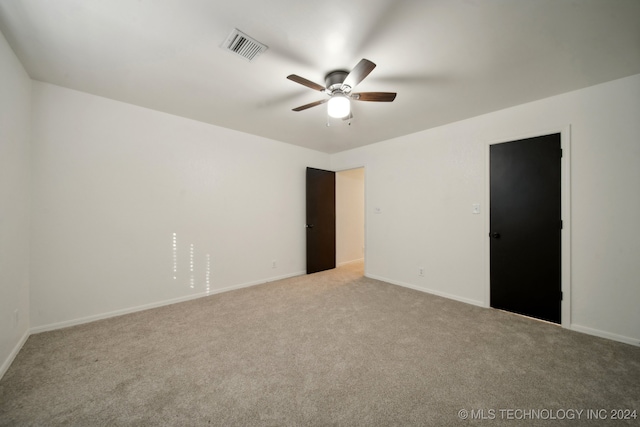 carpeted empty room with ceiling fan