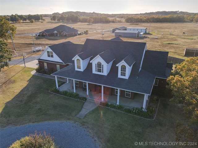 birds eye view of property with a rural view