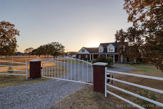 view of gate at dusk