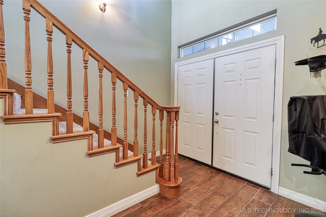 entryway with dark hardwood / wood-style floors