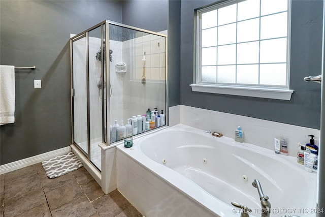 bathroom with shower with separate bathtub