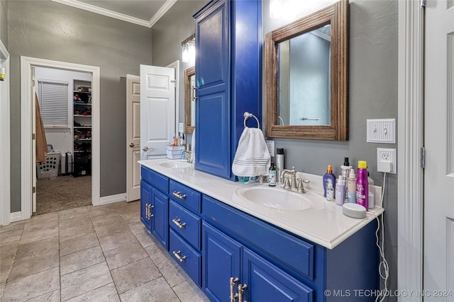 bathroom with vanity and ornamental molding