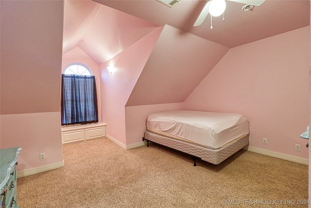 carpeted bedroom with ceiling fan and lofted ceiling