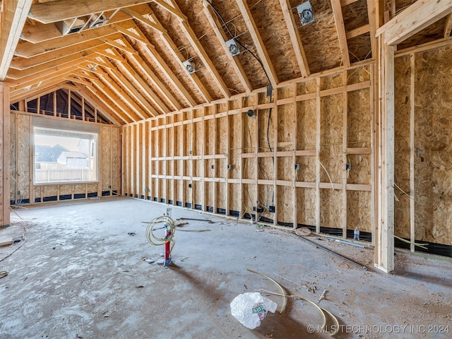 miscellaneous room featuring lofted ceiling