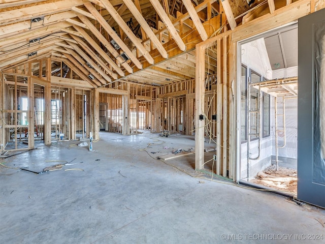 miscellaneous room with lofted ceiling