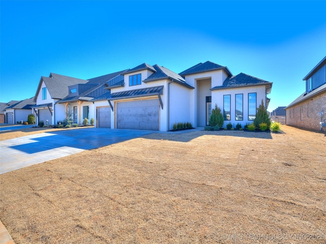 view of front of property with a garage