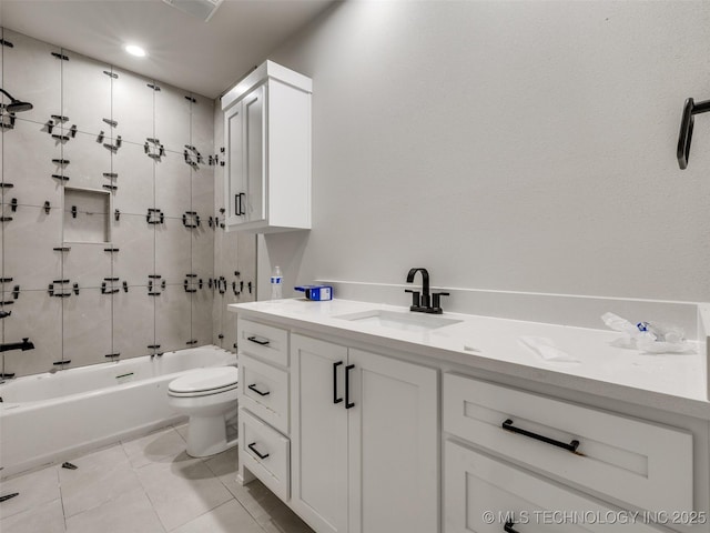 full bathroom featuring toilet, vanity, tile patterned floors, and tiled shower / bath