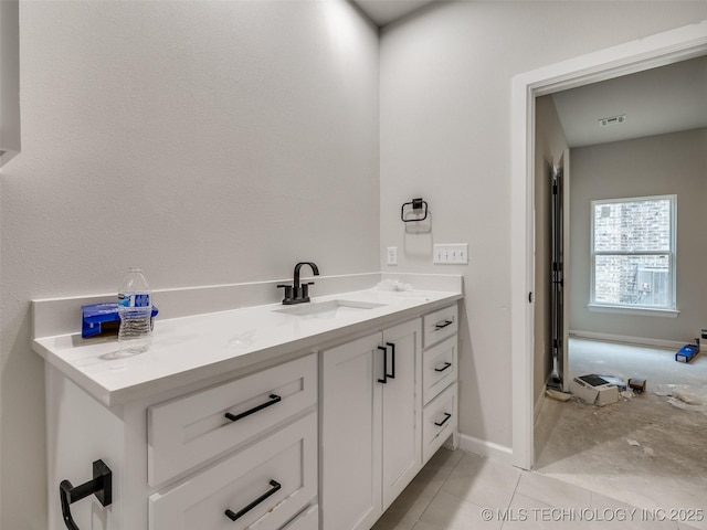 bathroom with tile patterned flooring and vanity