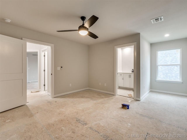 unfurnished bedroom with ceiling fan and ensuite bath