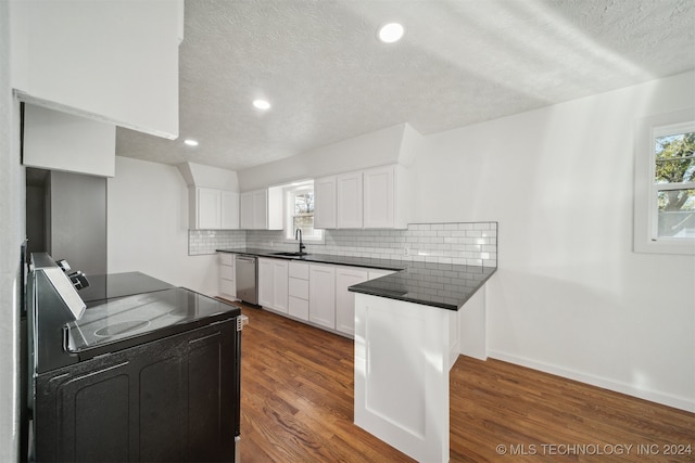 kitchen featuring decorative backsplash, dark hardwood / wood-style flooring, stainless steel dishwasher, white cabinetry, and range with electric stovetop