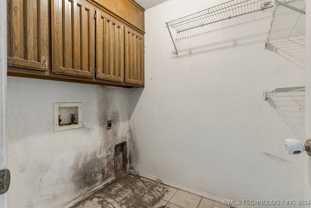 laundry room featuring hookup for a washing machine, light tile patterned floors, cabinets, and hookup for an electric dryer