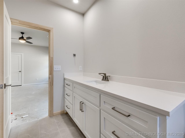 bathroom featuring ceiling fan, vanity, and tile patterned flooring