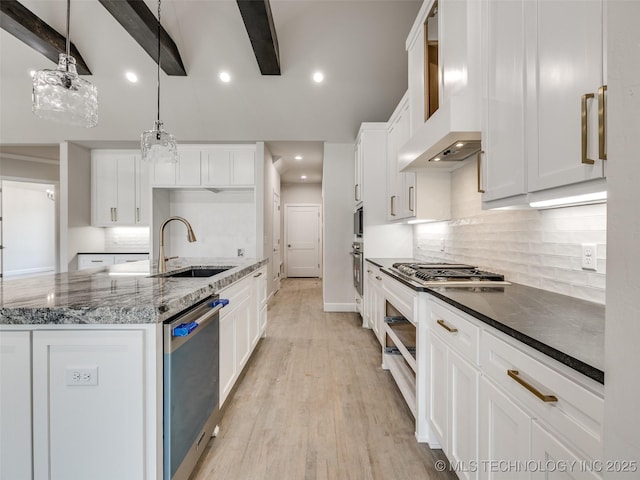 kitchen with white cabinetry, sink, premium range hood, and beam ceiling