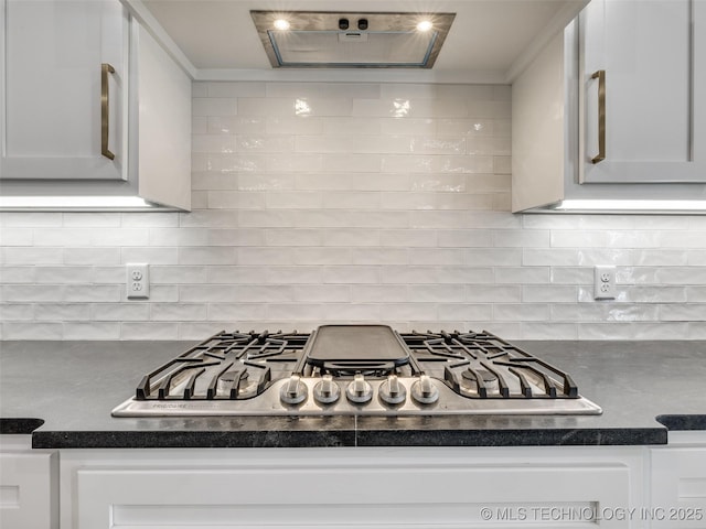 kitchen with white cabinetry, decorative backsplash, and stainless steel gas cooktop