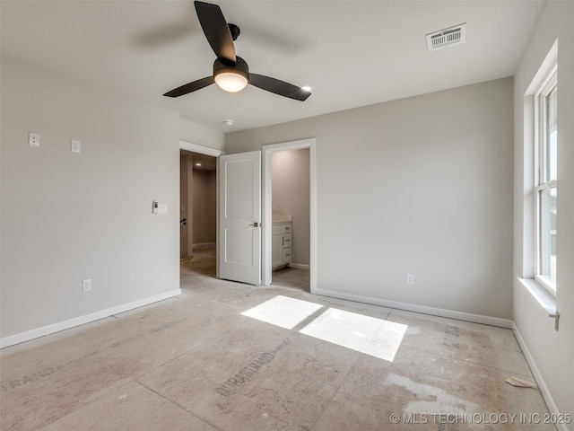 unfurnished bedroom featuring ensuite bathroom and ceiling fan