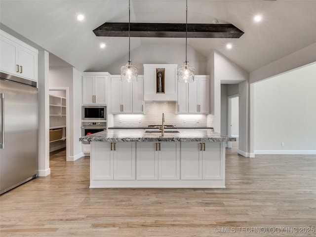 11224 S Fir Ave W, Jenks, OK 74037 - kitchen featuring built in appliances, white cabinets, and light stone countertops