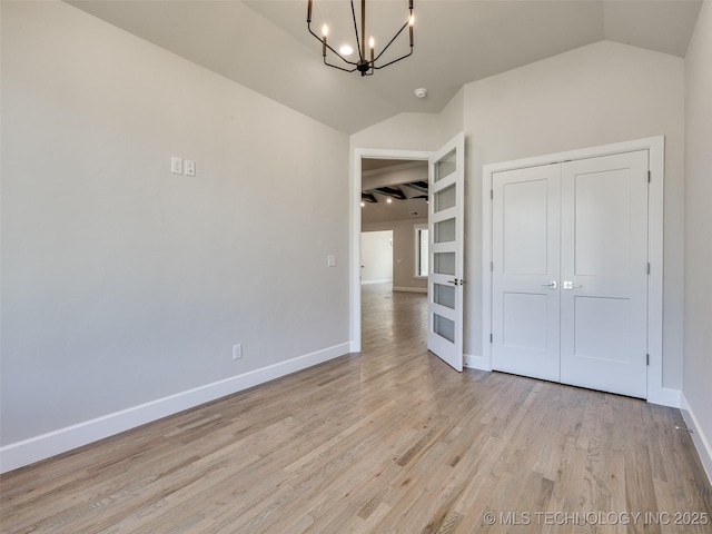 11224 S Fir Ave W, Jenks, OK 74037 - unfurnished dining area featuring vaulted ceiling, a chandelier, light wood-type flooring, and baseboards