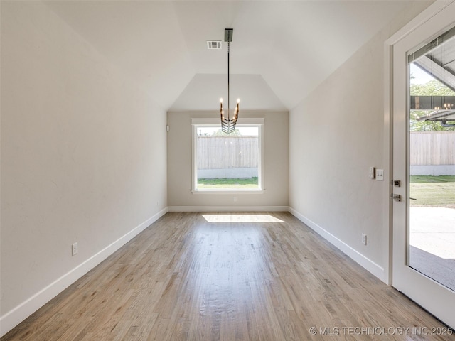 11224 S Fir Ave W, Jenks, OK 74037 - unfurnished dining area featuring a chandelier, plenty of natural light, wood finished floors, baseboards, and vaulted ceiling