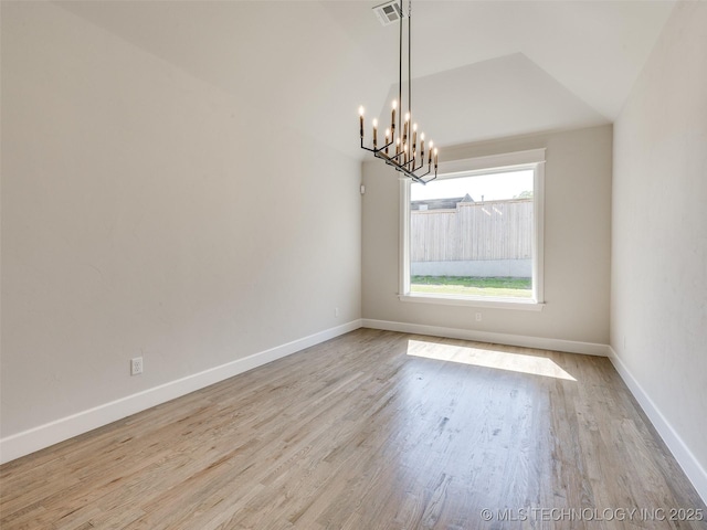 11224 S Fir Ave W, Jenks, OK 74037 - unfurnished room featuring a chandelier, wood finished floors, and baseboards