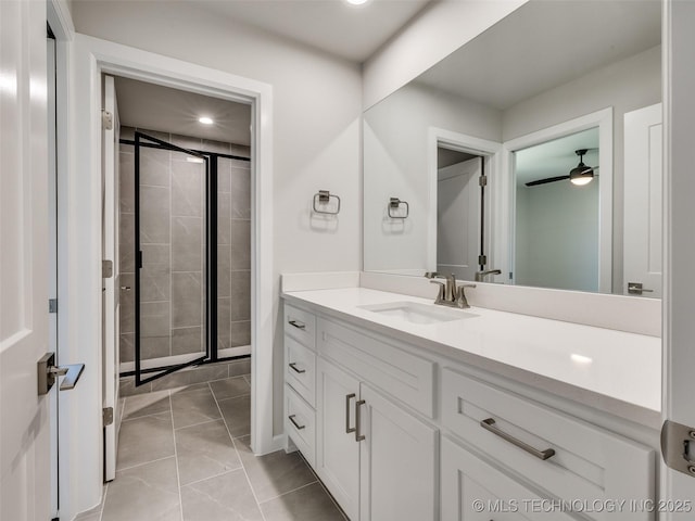 11224 S Fir Ave W, Jenks, OK 74037 - bathroom featuring vanity, marble look tile flooring, a shower stall, recessed lighting, and ceiling fan