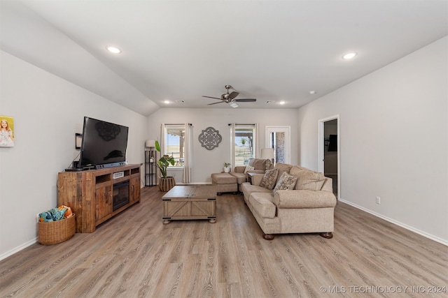 living room with vaulted ceiling, light hardwood / wood-style flooring, and ceiling fan