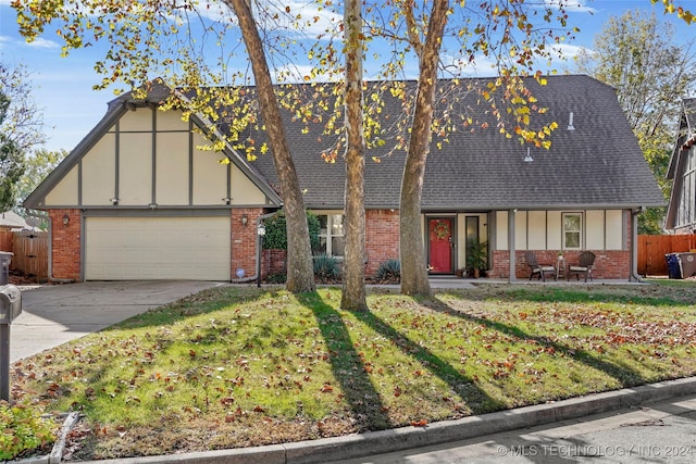 tudor house with a garage and a front lawn