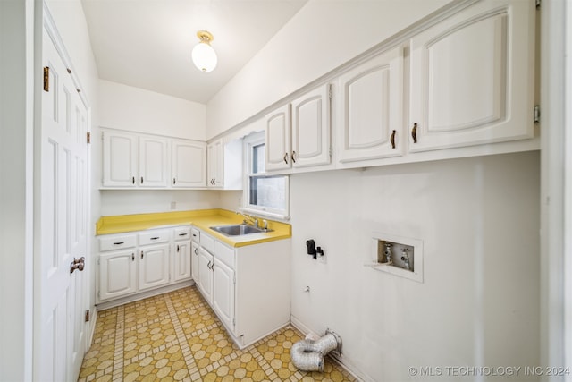 kitchen with white cabinetry and sink