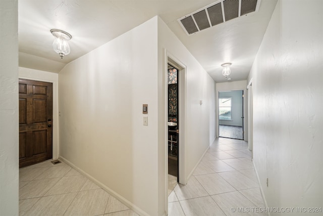 hallway with light tile patterned flooring