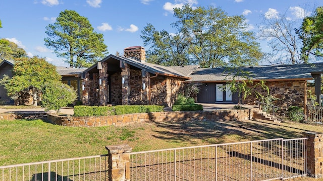 view of front of house featuring french doors and a front yard