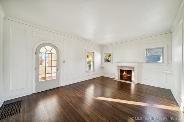 unfurnished living room with dark wood-type flooring