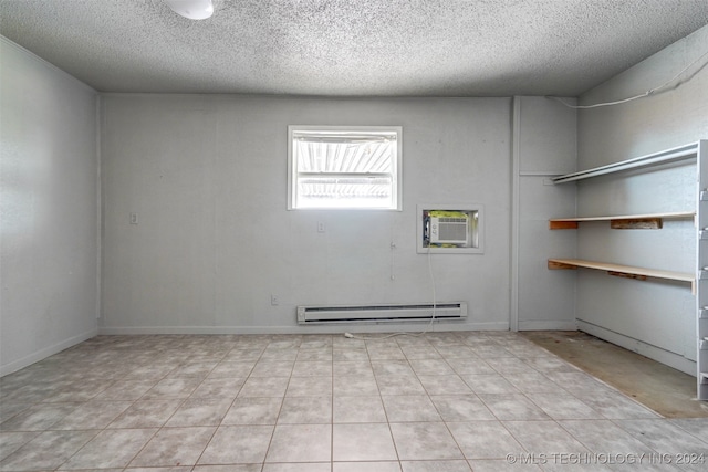 unfurnished room featuring a wall mounted AC, a textured ceiling, and baseboard heating