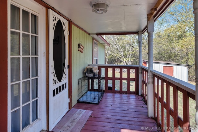 wooden deck featuring a porch